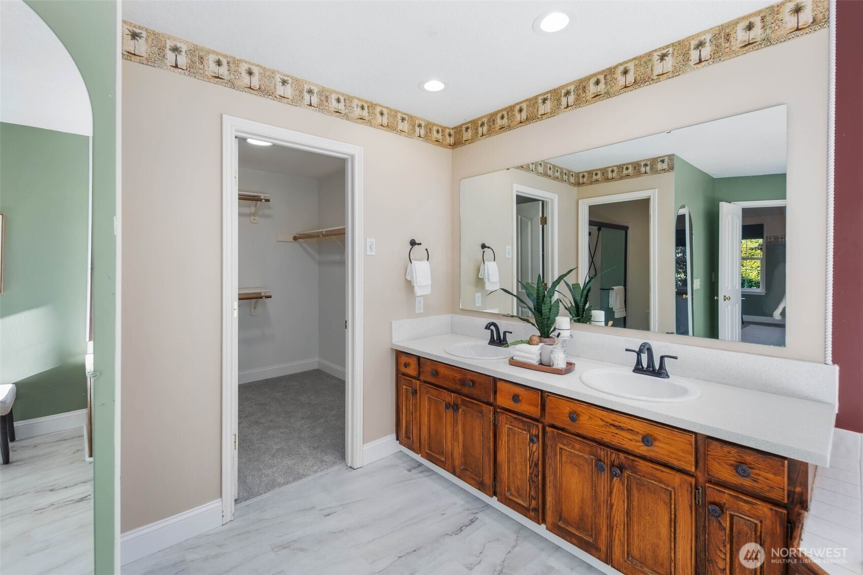 16104 Northeast 6th Court Ridgefield, WA 98642 - Photo 26 of 40 a bathroom with a double vanity sink and a mirror