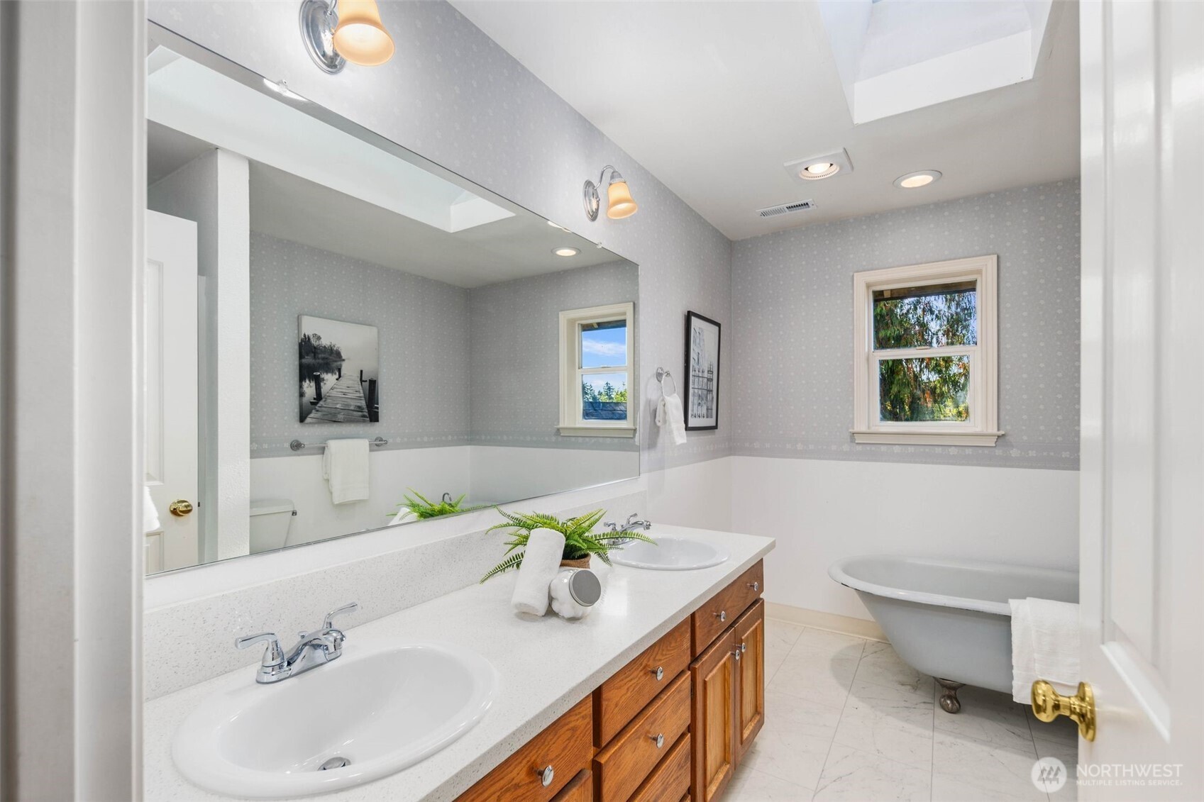 16104 Northeast 6th Court Ridgefield, WA 98642 - Photo 31 of 40 a bathroom with a sink a toilet and a mirror