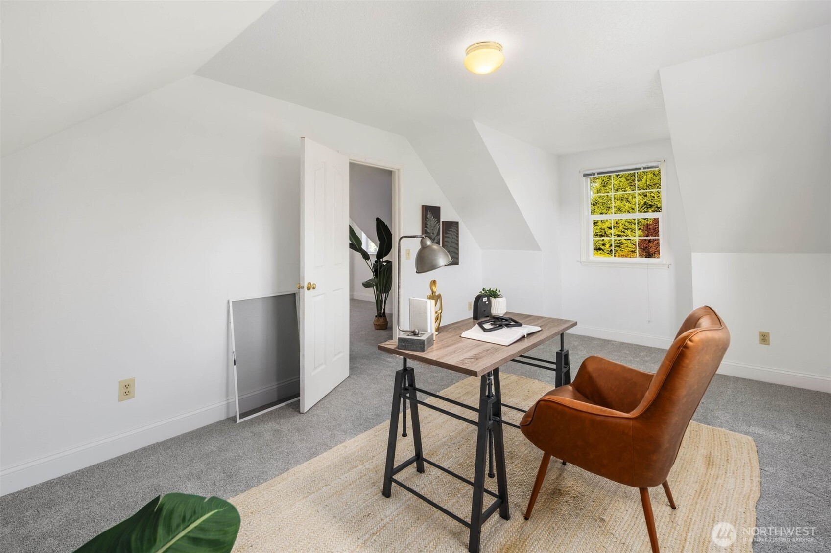 16104 Northeast 6th Court Ridgefield, WA 98642 - Photo 36 of 40 a view of a workspace with furniture and a window