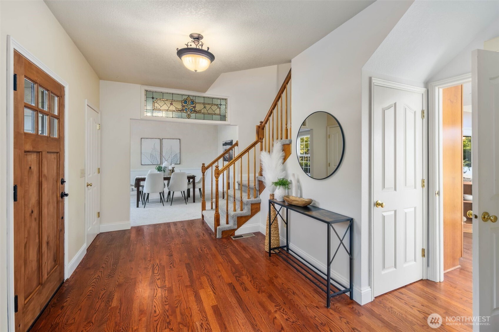 16104 Northeast 6th Court Ridgefield, WA 98642 - Photo 6 of 40 a view of a hallway with wooden floor and entryway
