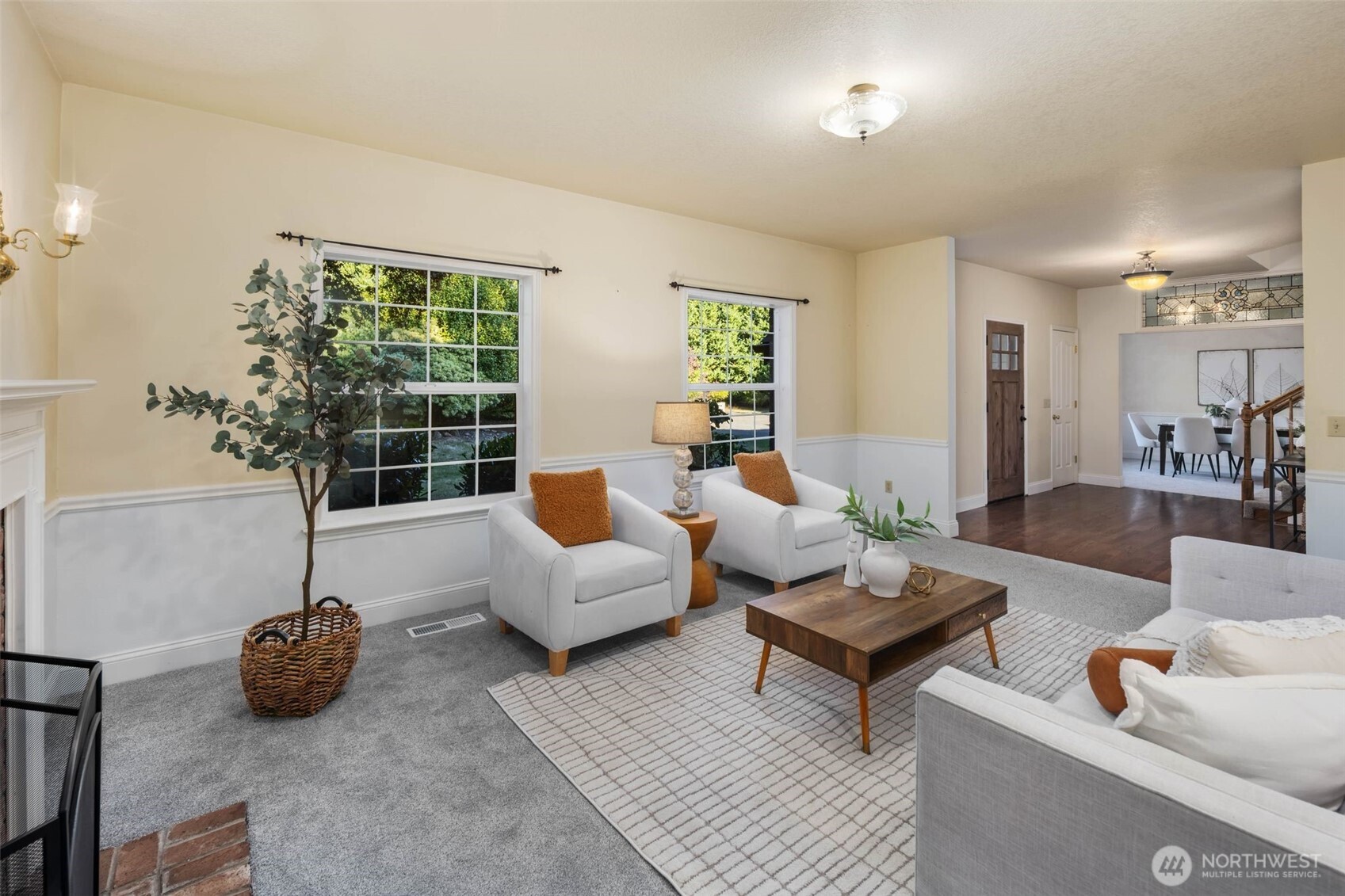 16104 Northeast 6th Court Ridgefield, WA 98642 - Photo 8 of 40 a living room with furniture and a potted plant