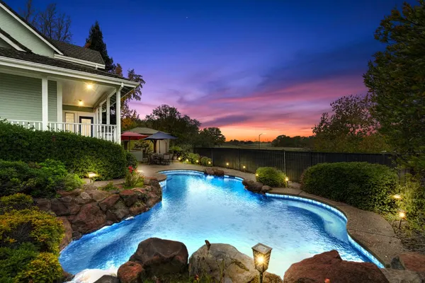 a view of a swimming pool with a patio