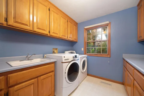 a utility room with dryer and washer