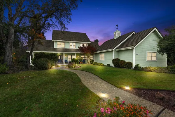 a front view of a house with a yard