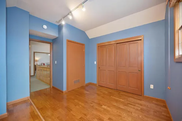 a view of an empty room and closet area