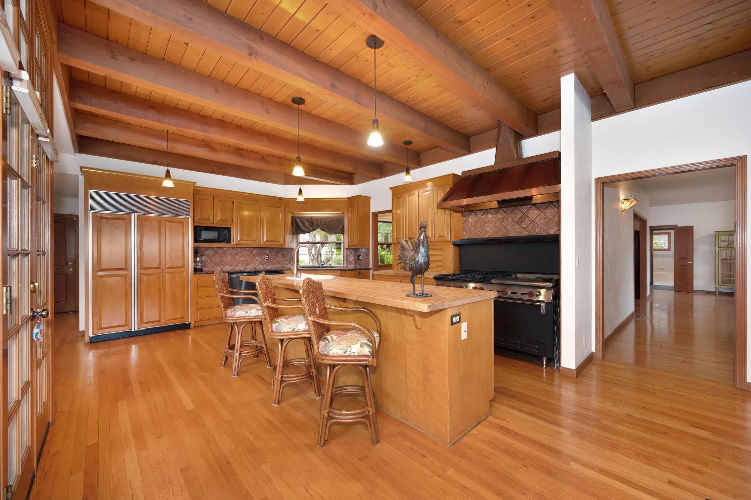6408 Puerto Drive Rancho Murieta, CA 95683 - Photo 5 of 49 Spacious gathering place kitchen, featuring a Wolfe range and an expansive butcher block island!