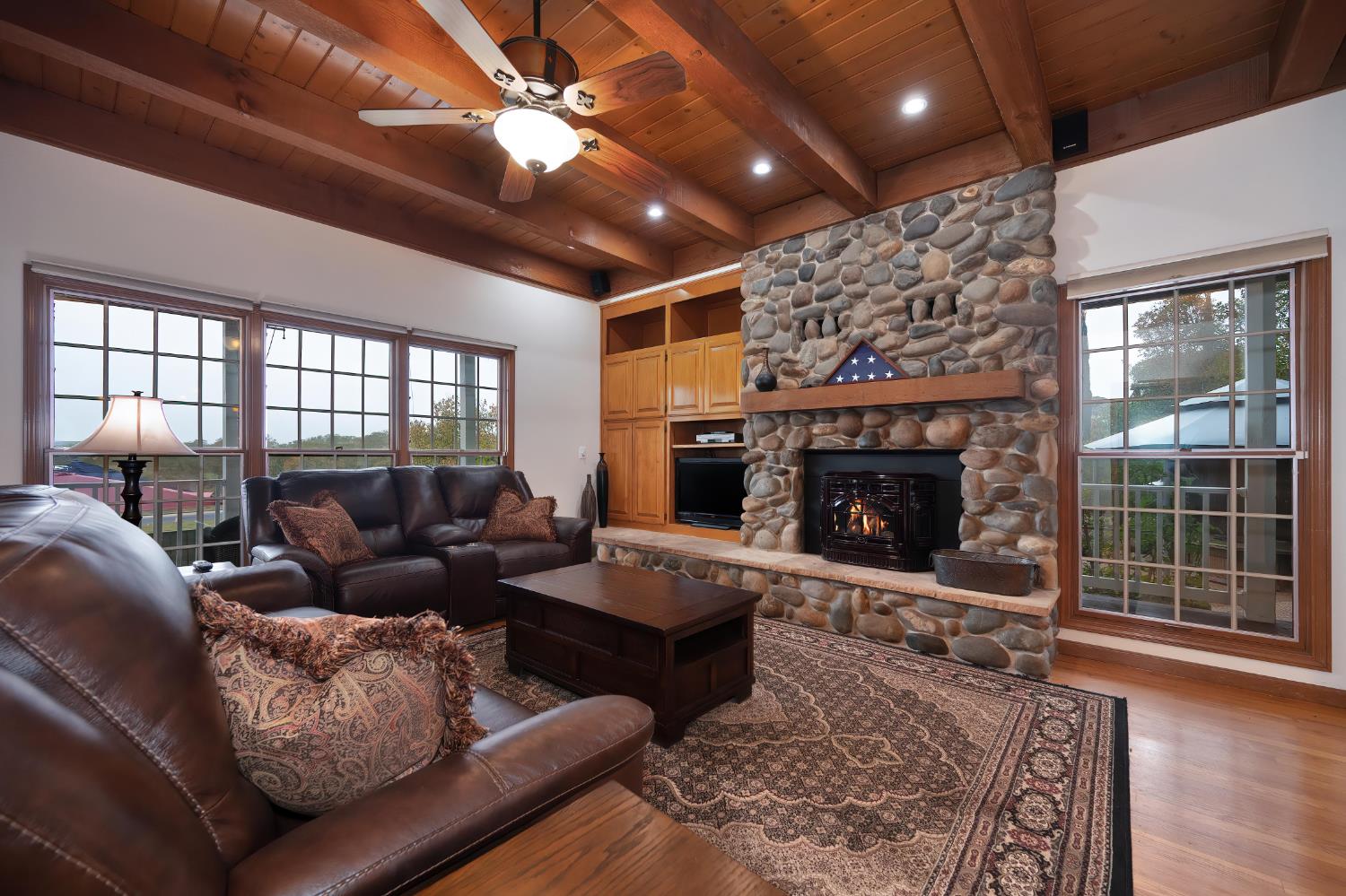 6408 Puerto Drive Rancho Murieta, CA 95683 - Photo 7 of 49 Family Room featuring a beautiful rock fireplace, raised hearth, wood beam ceilings plus an energy efficient Pellet Stove.