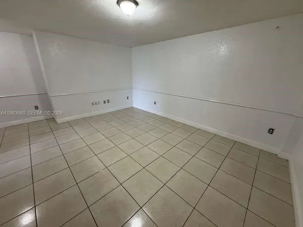 a view of a garage and cabinet