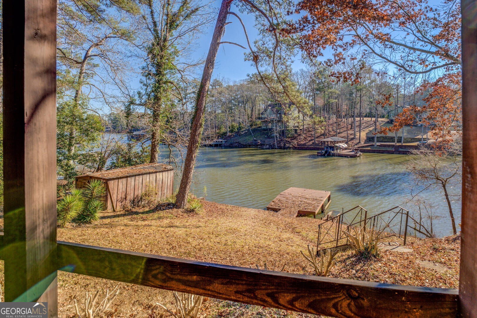 126 Shannon Way Jackson, GA 30233 - Photo 11 of 36 a view of a lake with trees in front of house