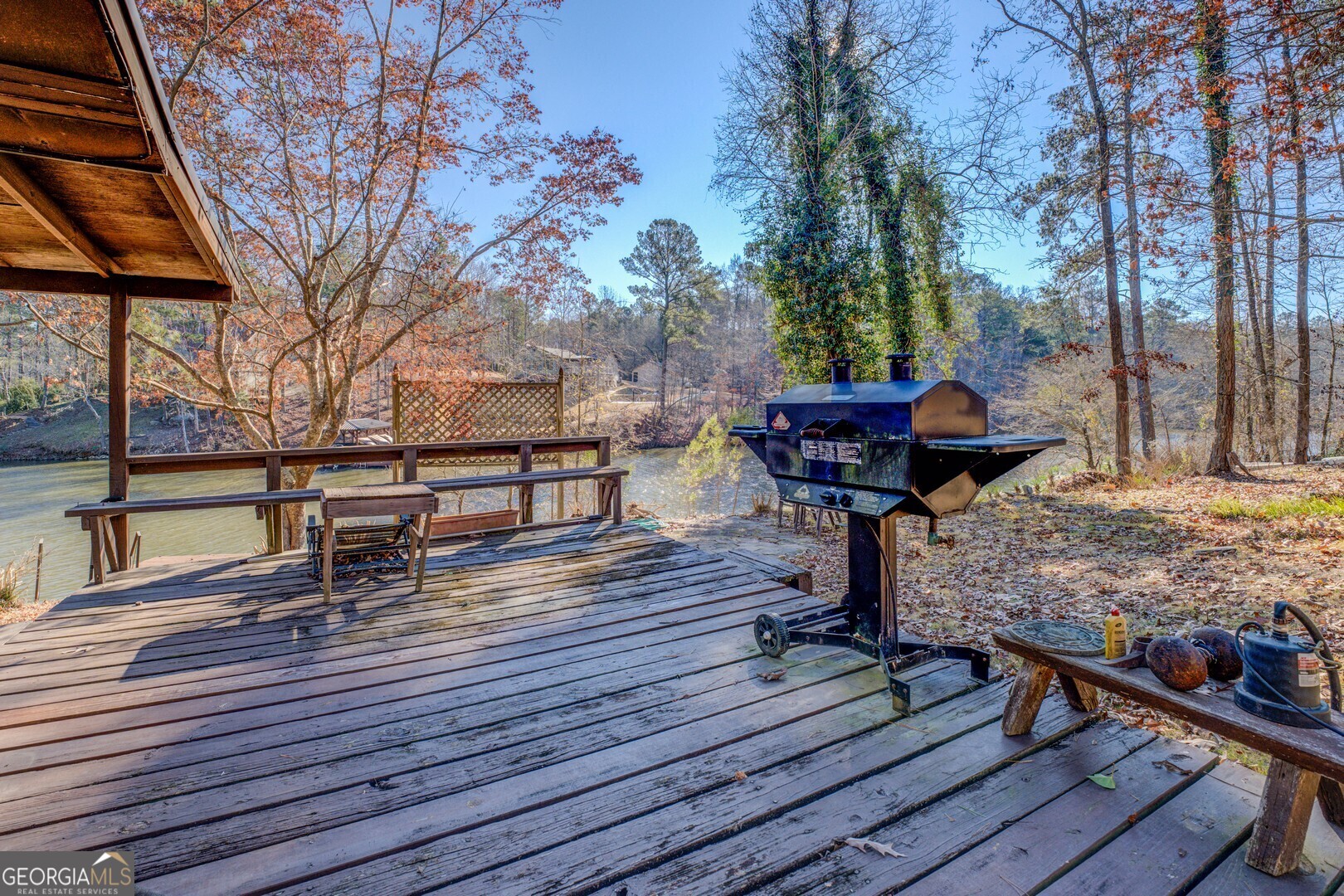 126 Shannon Way Jackson, GA 30233 - Photo 20 of 36 a view of outdoor seating space with wooden floor and trees