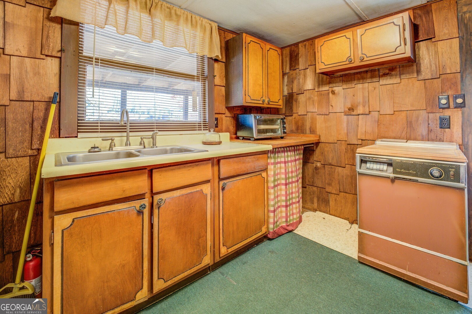 126 Shannon Way Jackson, GA 30233 - Photo 26 of 36 a kitchen with stainless steel appliances granite countertop a sink a stove and a refrigerator