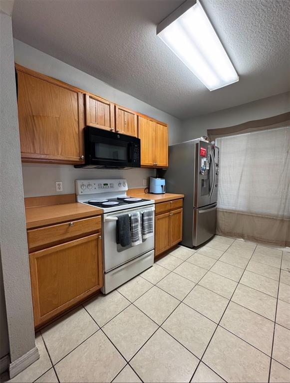 10801 Brickside Court Riverview, FL 33579 - Photo 3 of 16 a kitchen with cabinets and steel stainless steel appliances