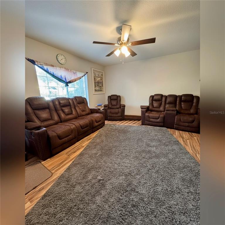 10801 Brickside Court Riverview, FL 33579 - Photo 5 of 16 a living room with furniture