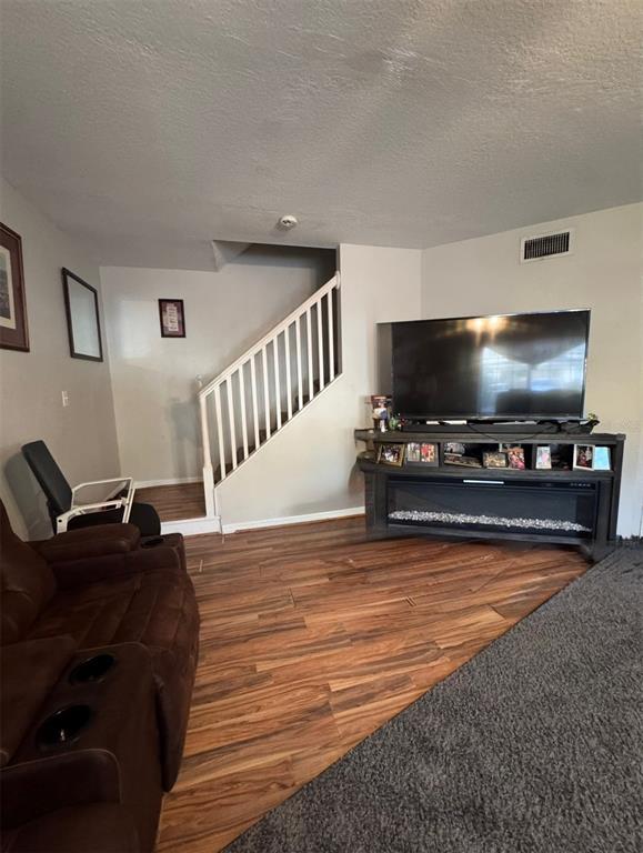 10801 Brickside Court Riverview, FL 33579 - Photo 6 of 16 a living room with furniture and a flat screen tv