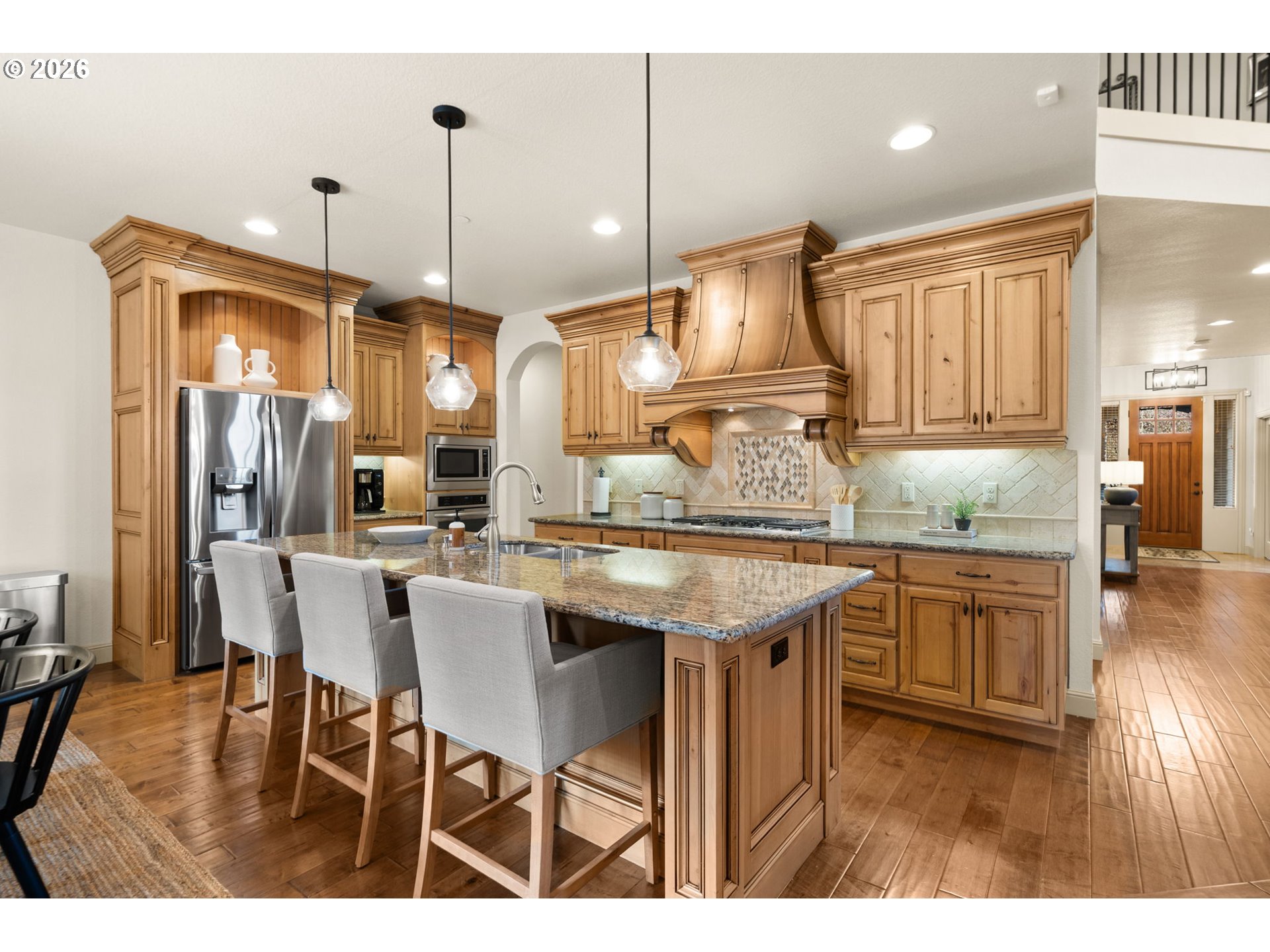 1406 Northwest 44th Avenue Camas, WA 98607 - Photo 11 of 48 a kitchen with granite countertop a sink cabinets and stainless steel appliances