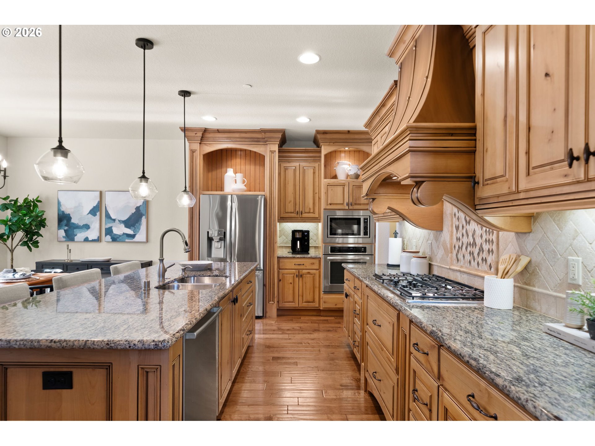 1406 Northwest 44th Avenue Camas, WA 98607 - Photo 12 of 48 a kitchen with stainless steel appliances granite countertop a sink a stove and a wooden floors