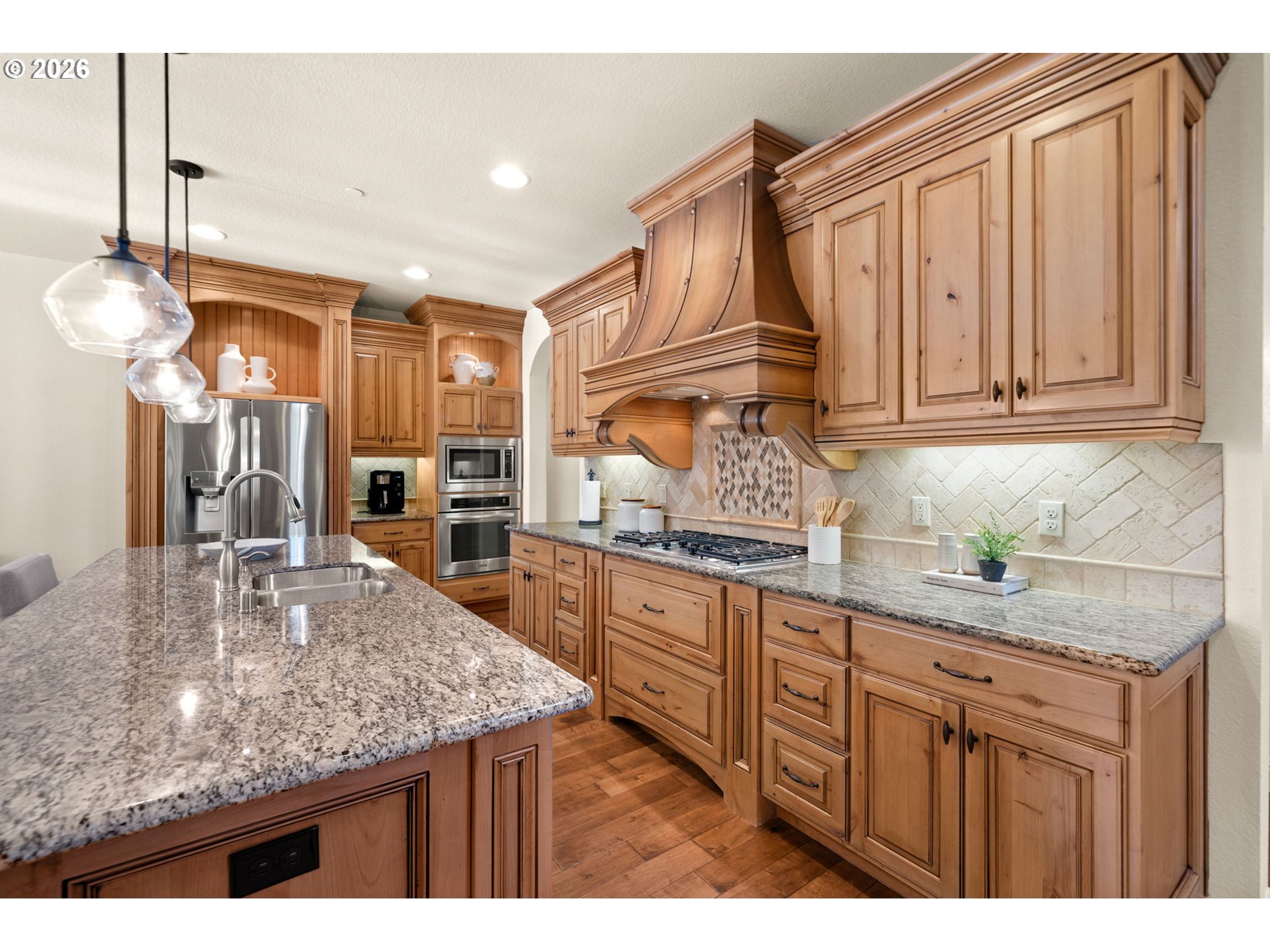 1406 Northwest 44th Avenue Camas, WA 98607 - Photo 13 of 48 a kitchen with stainless steel appliances granite countertop a sink and cabinets
