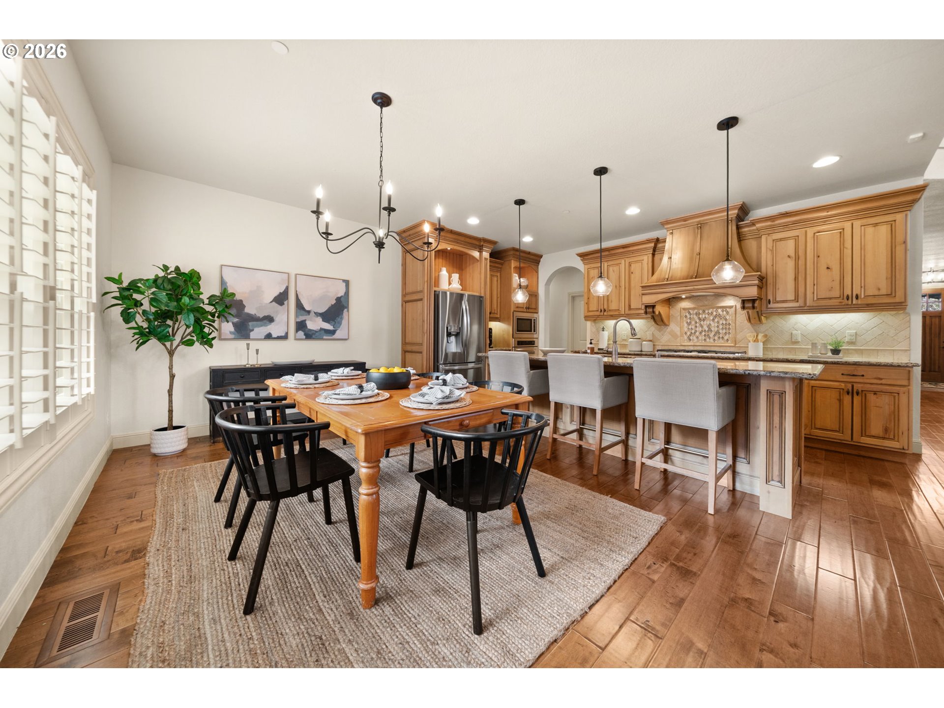 1406 Northwest 44th Avenue Camas, WA 98607 - Photo 16 of 48 a dining hall with stainless steel appliances kitchen island a table and chairs