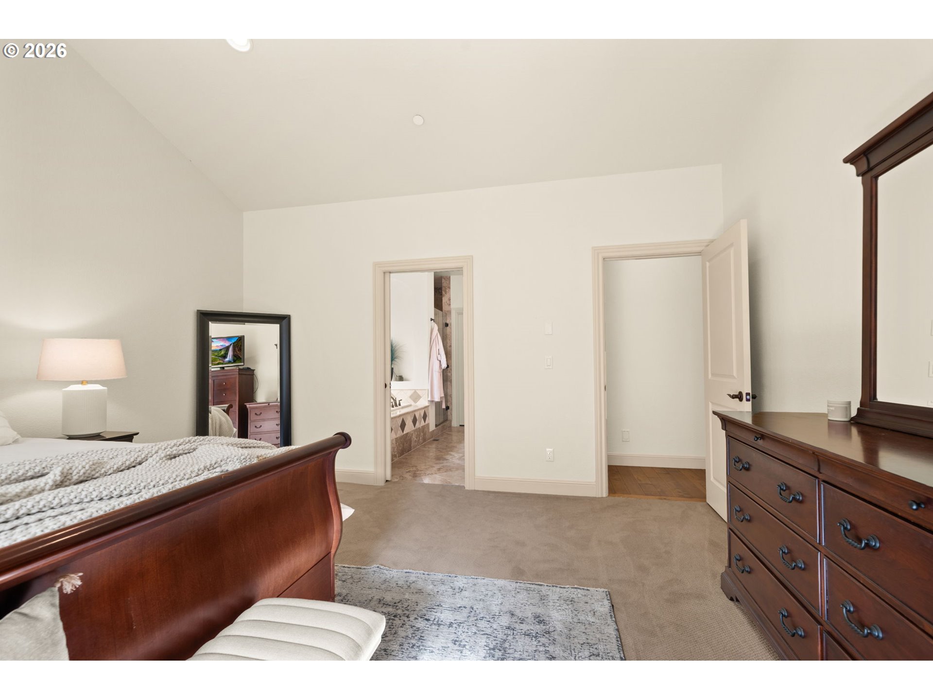 1406 Northwest 44th Avenue Camas, WA 98607 - Photo 23 of 48 a bedroom with a bed and dresser with mirror