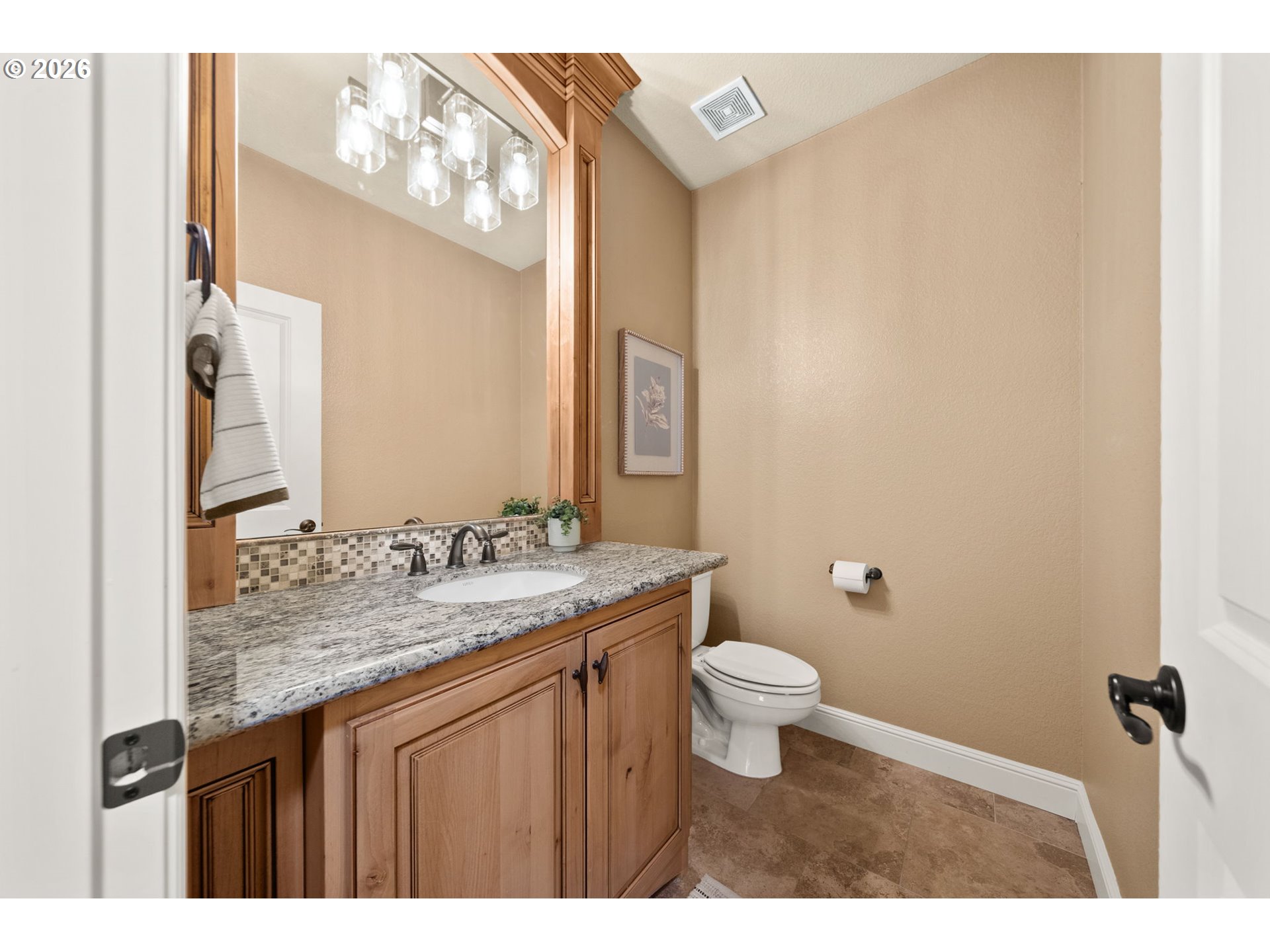 1406 Northwest 44th Avenue Camas, WA 98607 - Photo 32 of 48 a bathroom with a granite countertop sink toilet and mirror