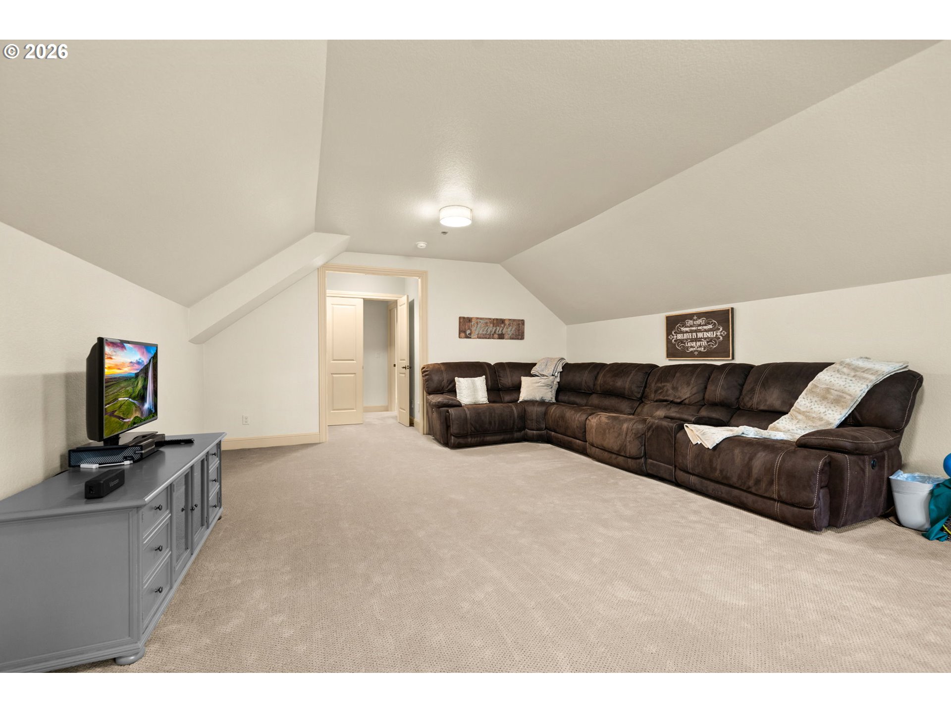 1406 Northwest 44th Avenue Camas, WA 98607 - Photo 34 of 48 a living room with furniture and a flat screen tv