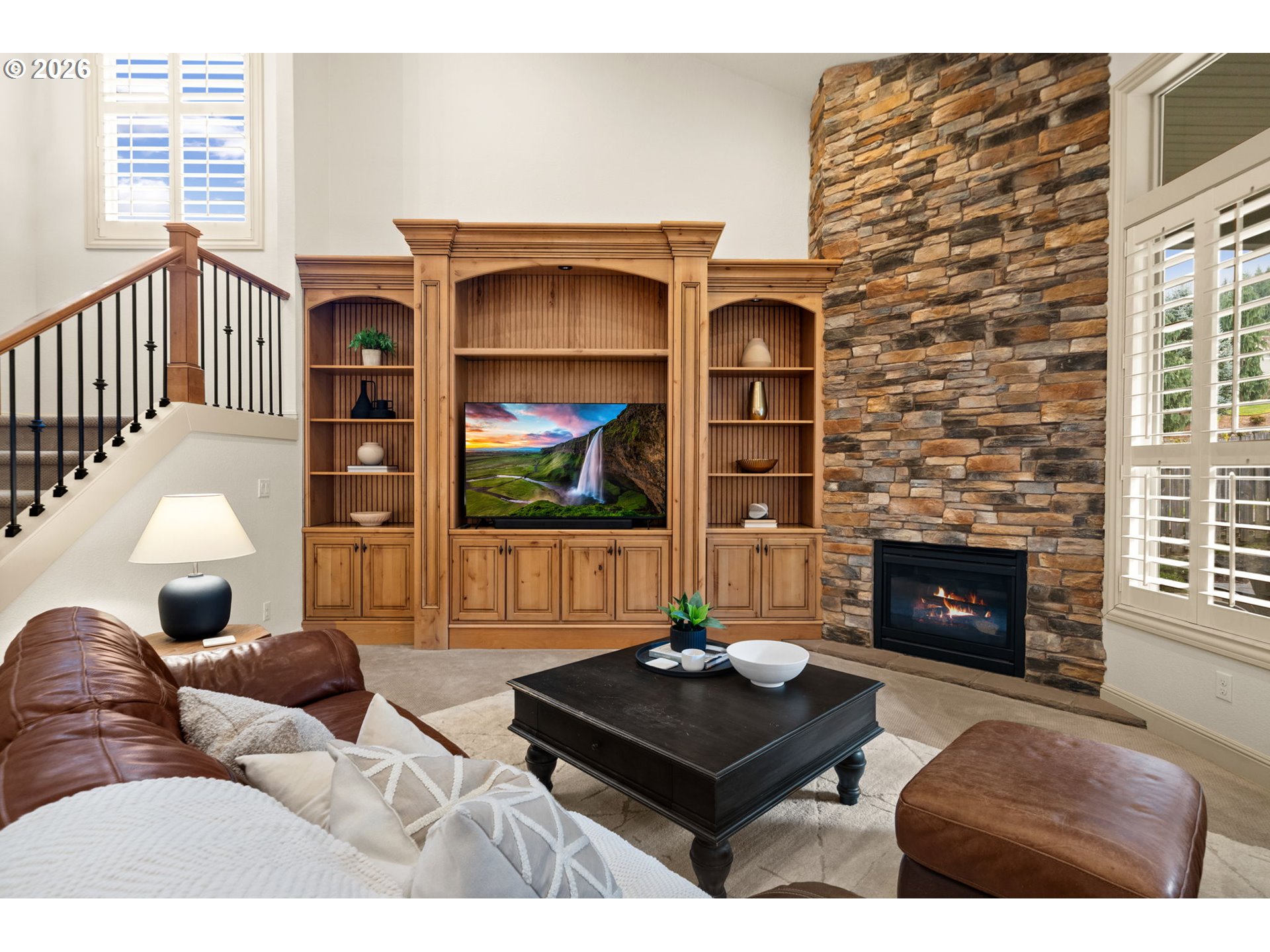 1406 Northwest 44th Avenue Camas, WA 98607 - Photo 10 of 48 a living room with furniture a flat screen tv and a fireplace