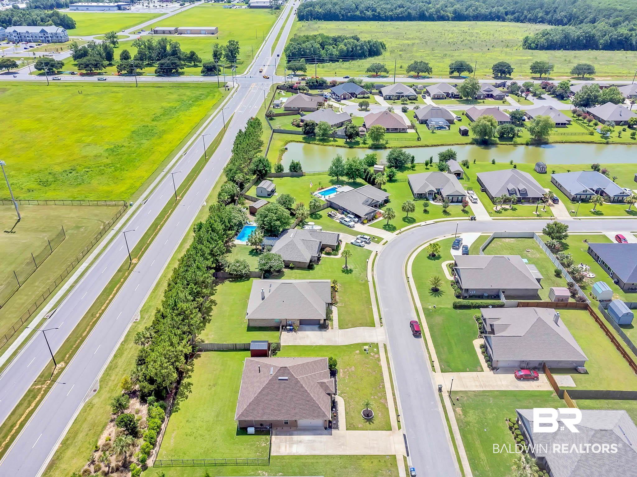 2049 Bourbon Street Foley, AL 36535 - Photo 52 of 56 Aerial view of residential area featuring a large body of water