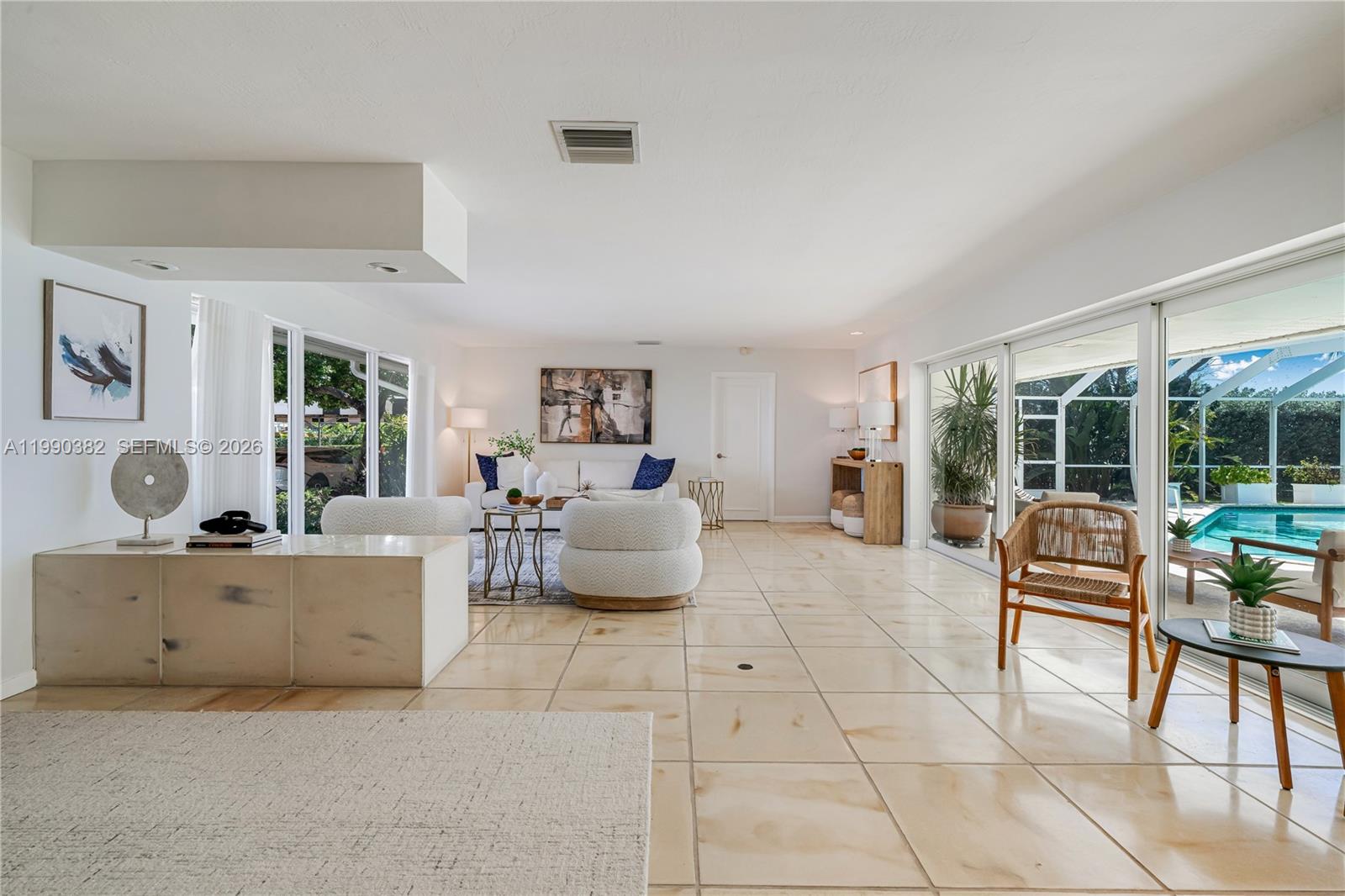 640 South Mashta Drive Key Biscayne, FL 33149 - Photo 12 of 38 a living room with furniture and a table