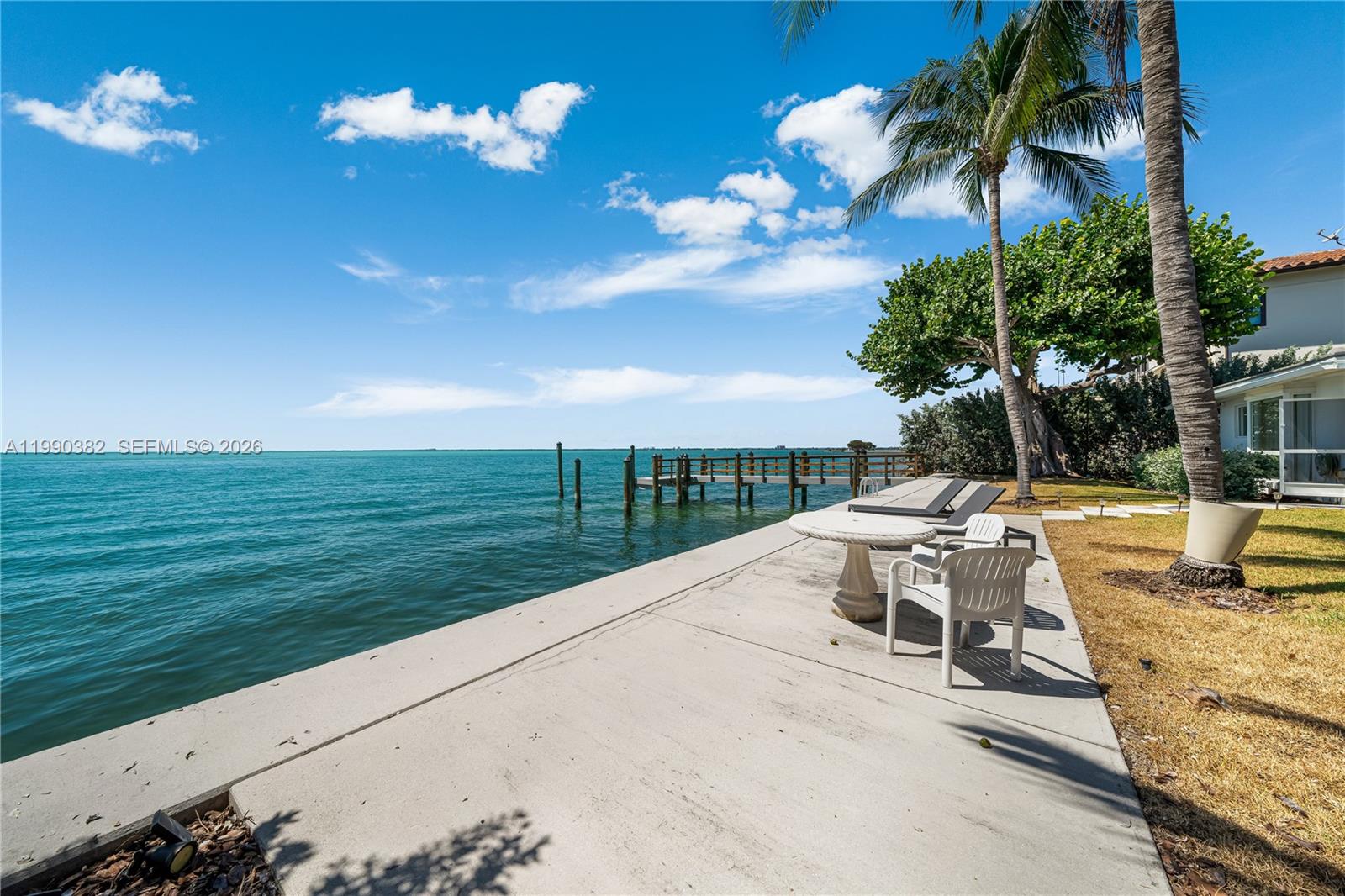 640 South Mashta Drive Key Biscayne, FL 33149 - Photo 15 of 38 a view of a terrace with lawn chairs