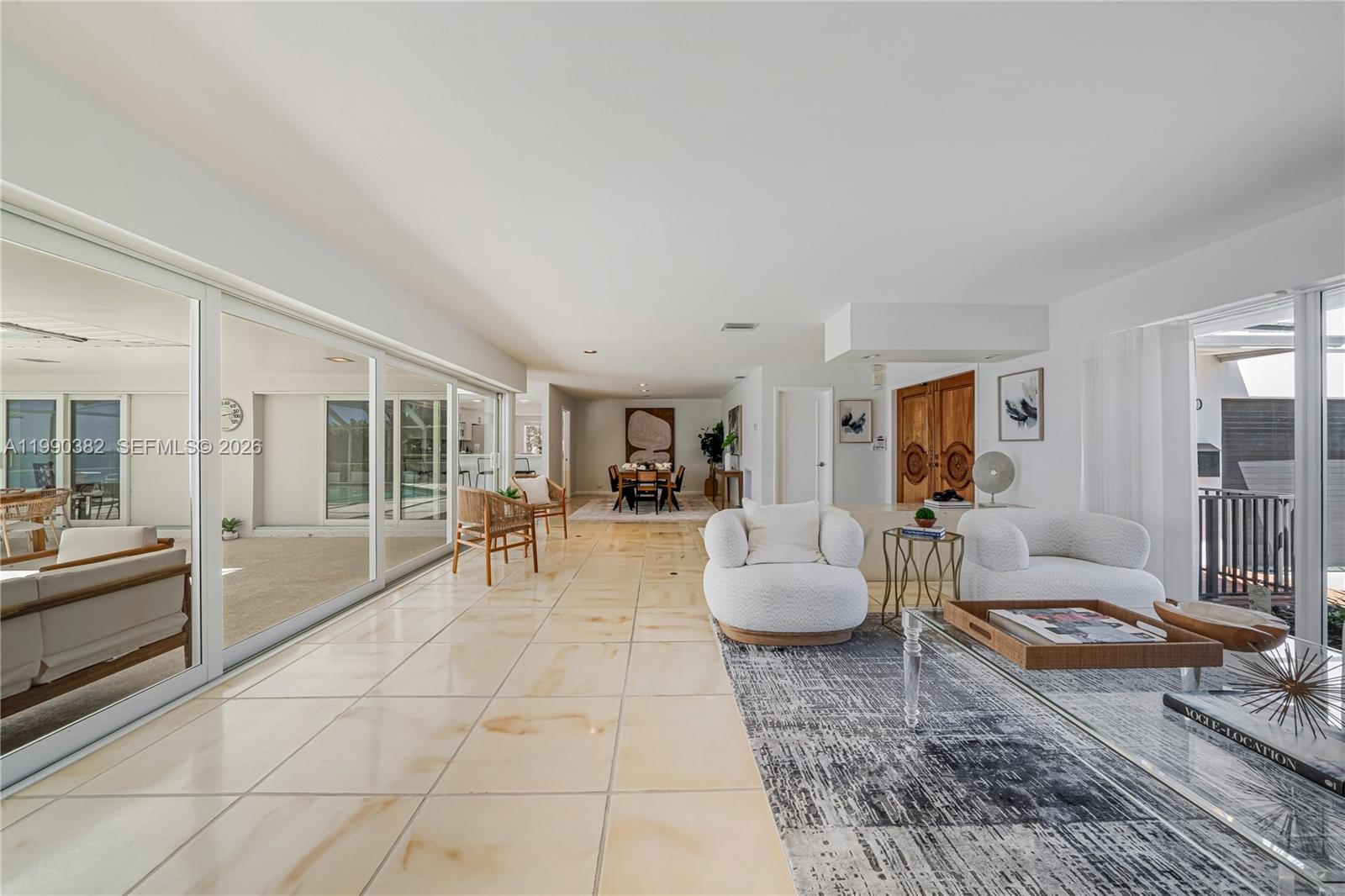 640 South Mashta Drive Key Biscayne, FL 33149 - Photo 19 of 38 a living room with furniture and a table