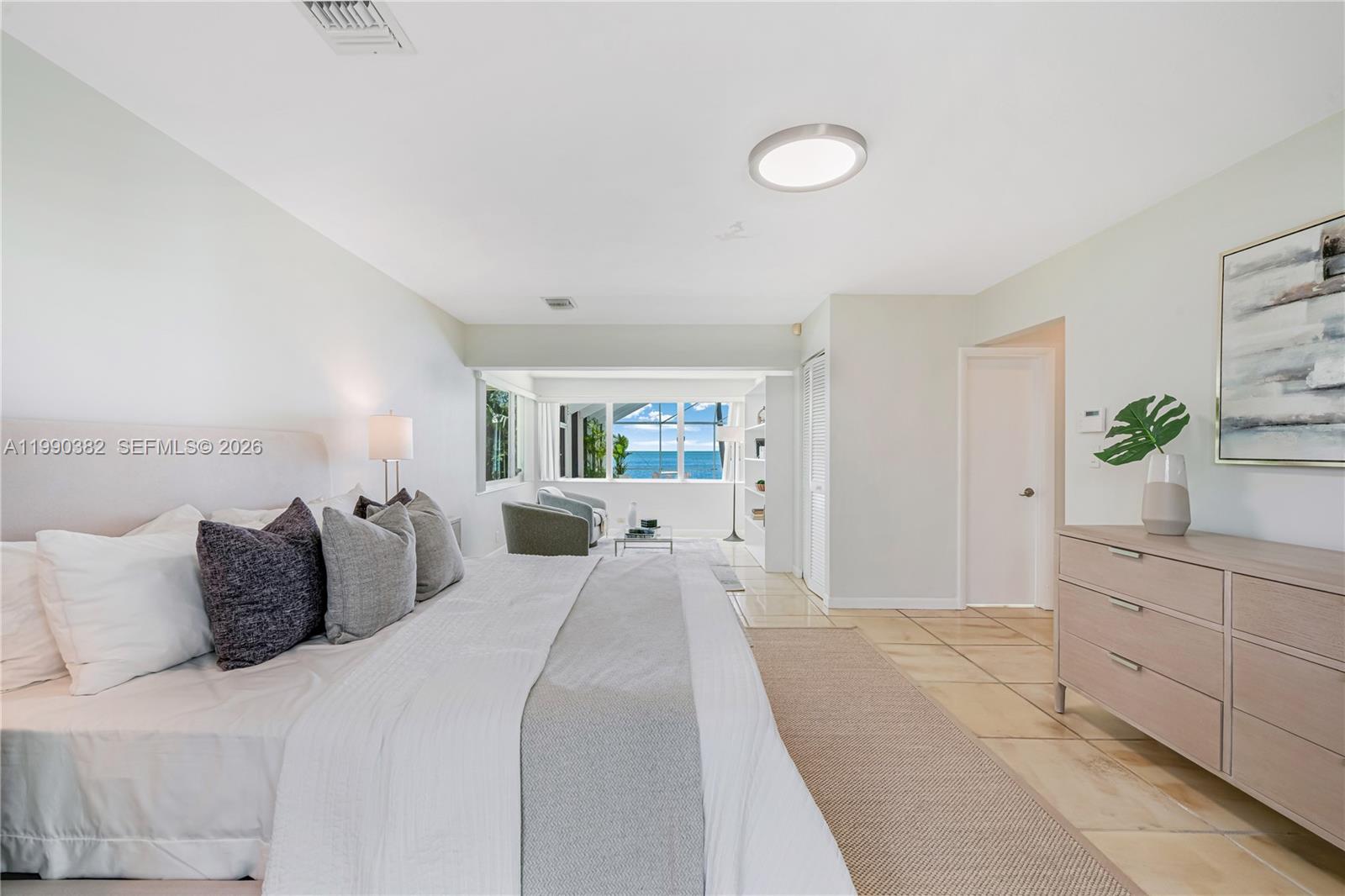 640 South Mashta Drive Key Biscayne, FL 33149 - Photo 21 of 38 a bedroom with a bed and a potted plant