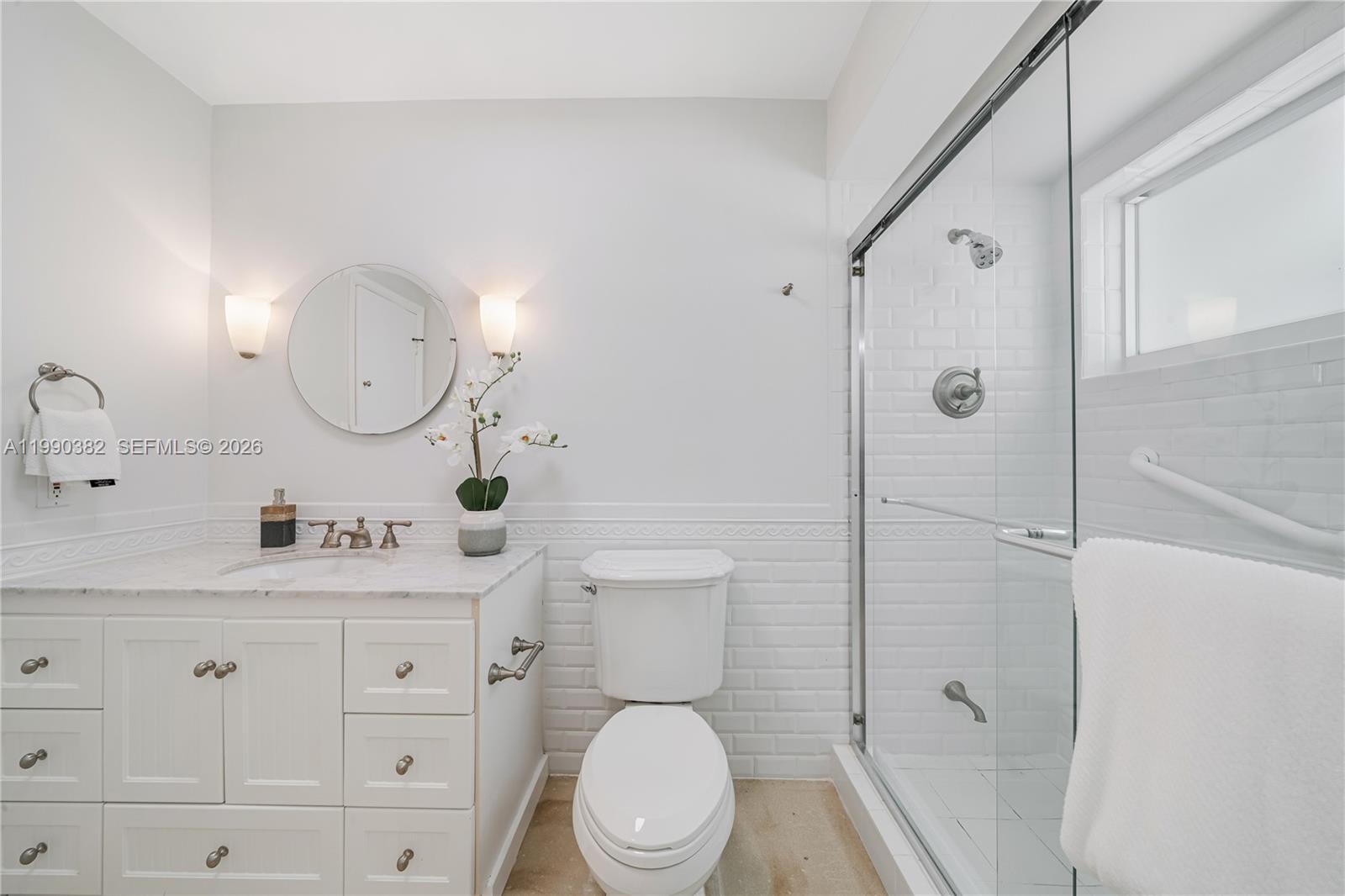 640 South Mashta Drive Key Biscayne, FL 33149 - Photo 22 of 38 a bathroom with a toilet a sink and shower