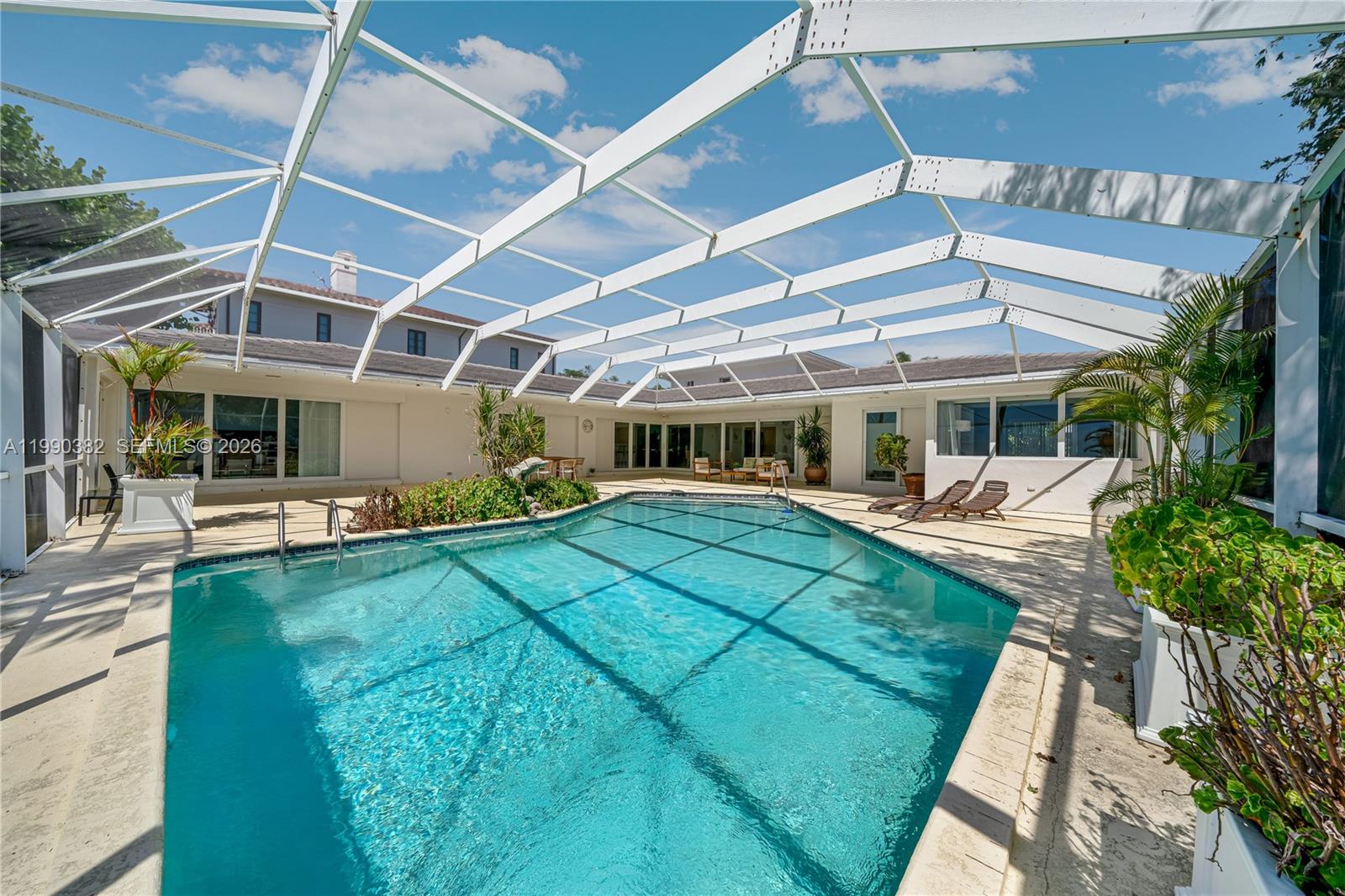 640 South Mashta Drive Key Biscayne, FL 33149 - Photo 26 of 38 a view of a backyard with sitting area