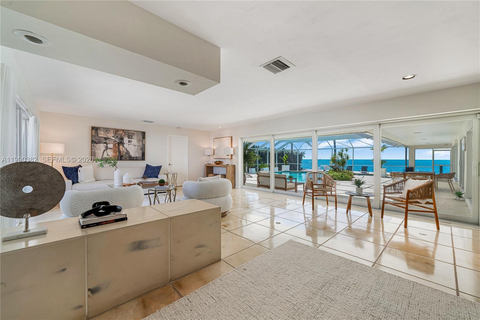640 South Mashta Drive Key Biscayne, FL 33149 - Photo 30 of 38 a living room with furniture and a large window