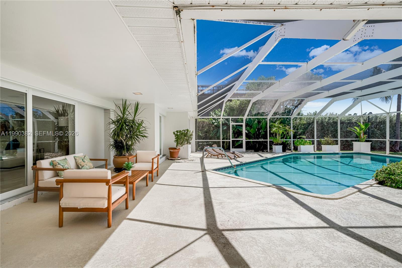 640 South Mashta Drive Key Biscayne, FL 33149 - Photo 31 of 38 a view of a house with backyard porch and sitting area