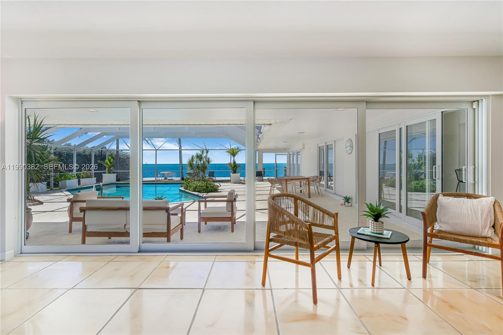 640 South Mashta Drive Key Biscayne, FL 33149 - Photo 33 of 38 a view of a patio with a table and chairs