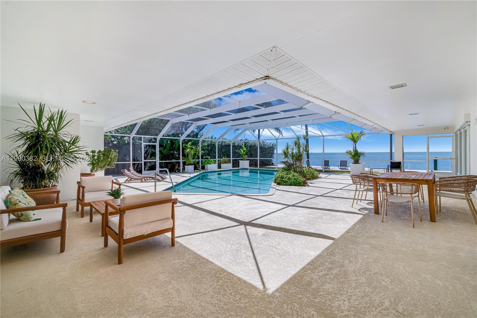 640 South Mashta Drive Key Biscayne, FL 33149 - Photo 35 of 38 a living room with furniture a table and chairs