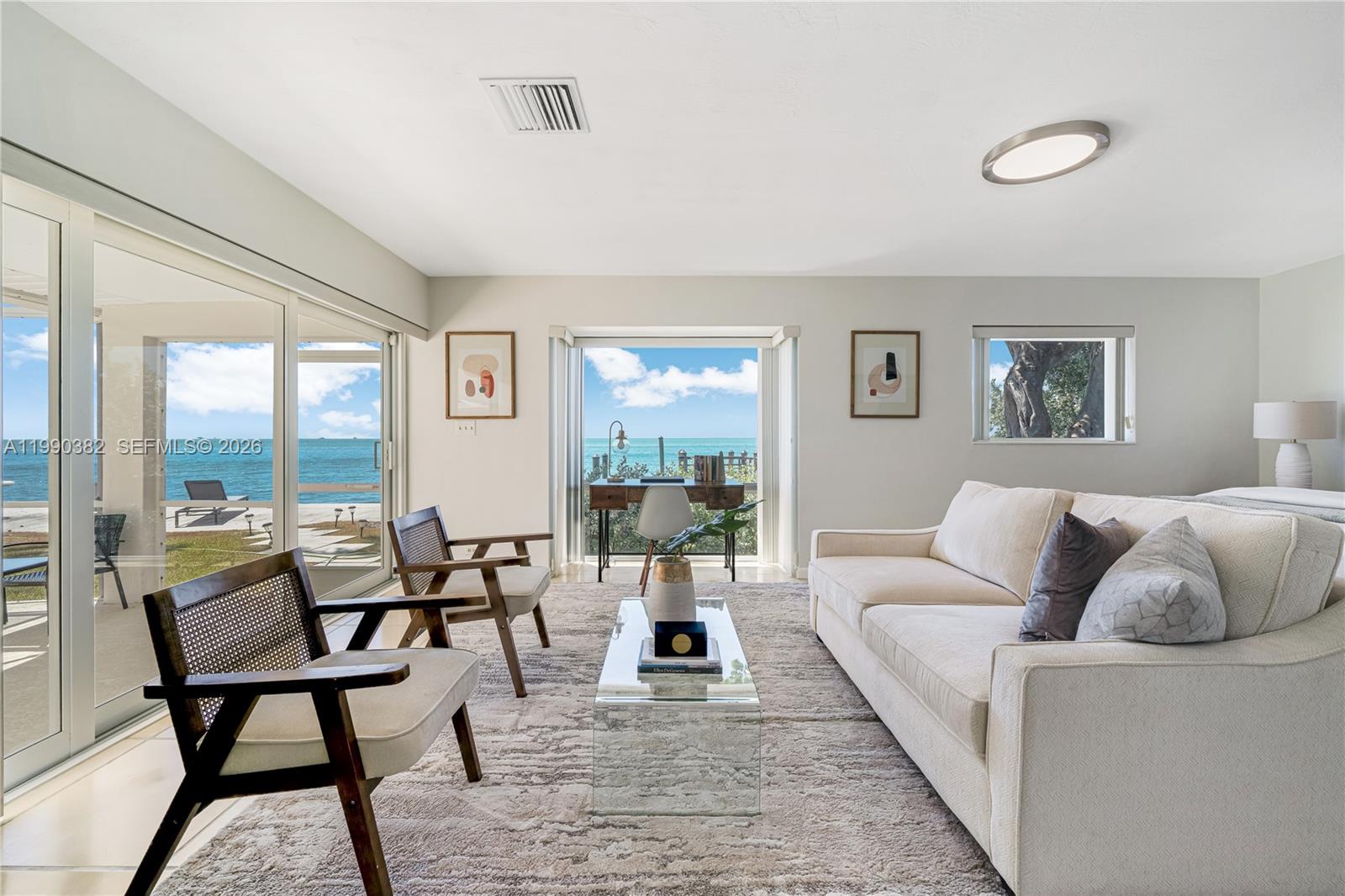 640 South Mashta Drive Key Biscayne, FL 33149 - Photo 36 of 38 a living room with furniture and a large window