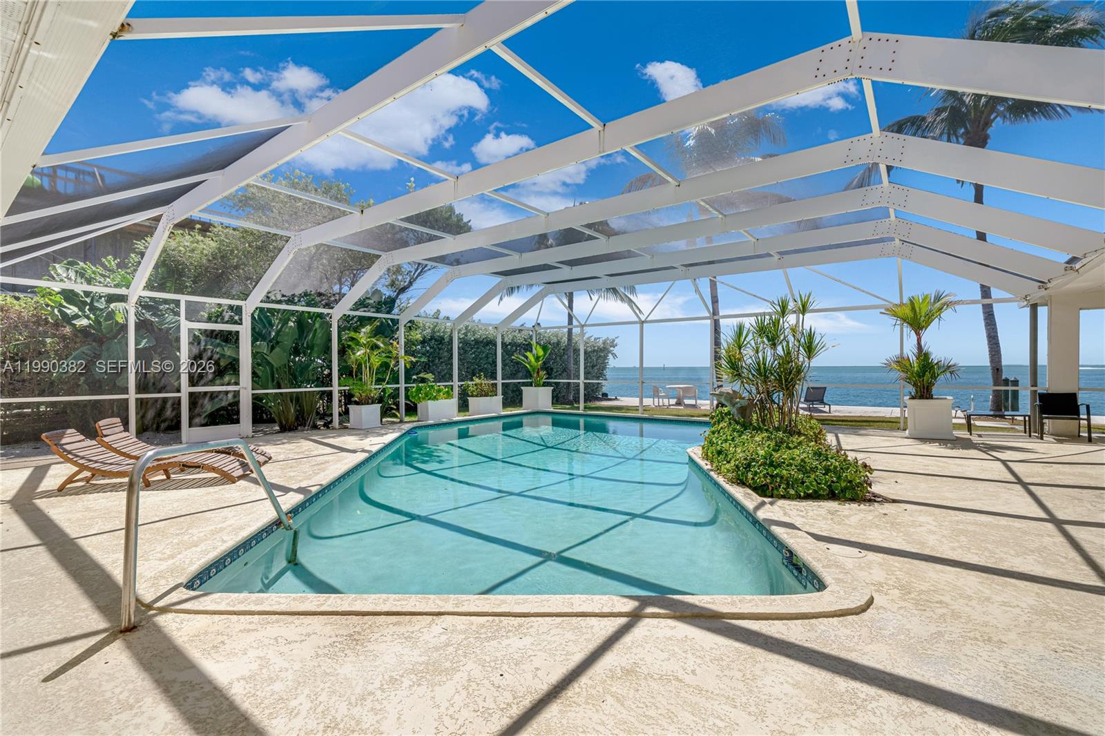 640 South Mashta Drive Key Biscayne, FL 33149 - Photo 6 of 38 a view of a swimming pool with a patio