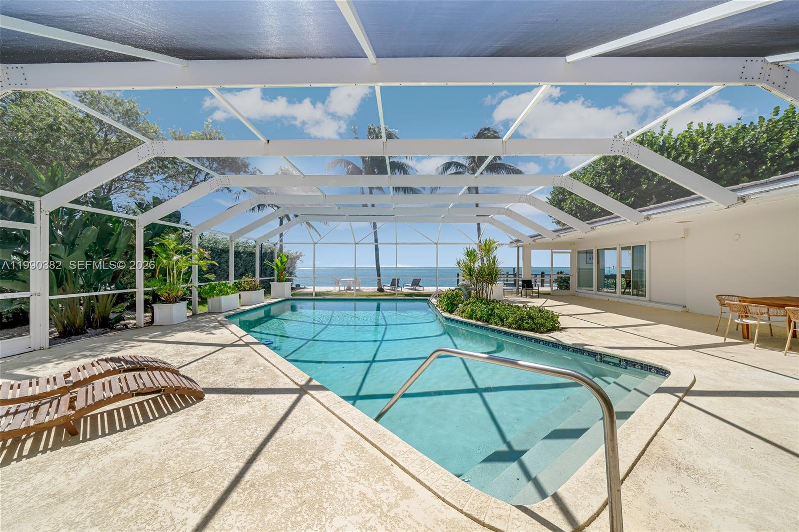 640 South Mashta Drive Key Biscayne, FL 33149 - Photo 8 of 38 a view of a swimming pool with a patio