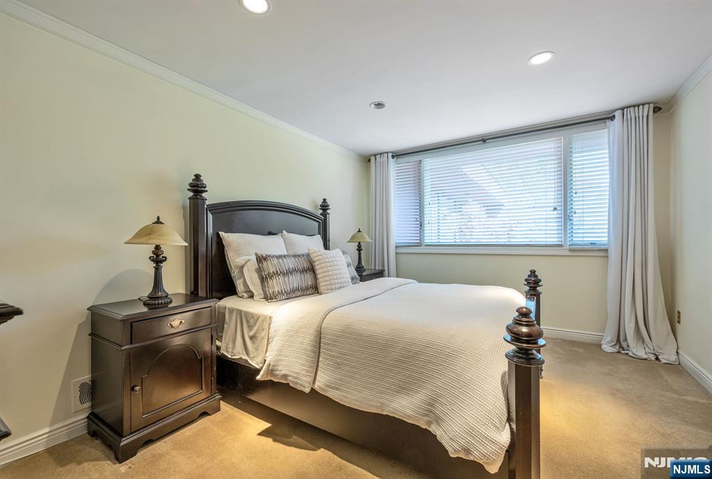 84 Bogerts Mill Road Harrington Park, NJ 07640 - Photo 27 of 47 a bedroom with a bed and a window