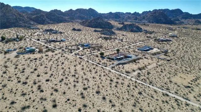 a view of a road with a building in the background