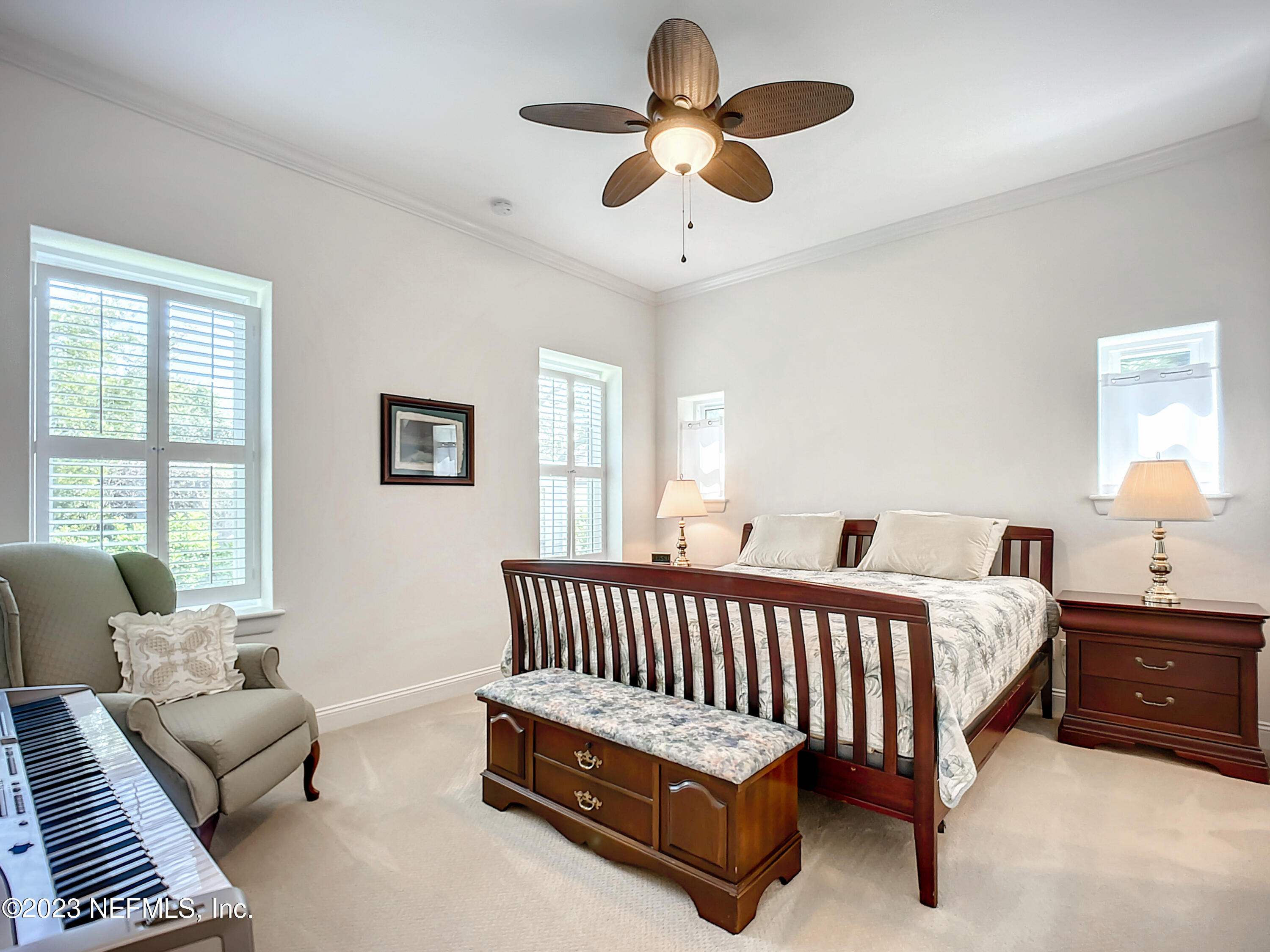 5356 2nd Street St. Augustine, FL 32080 - Photo 23 of 60 a bed room with a bed couch and a window