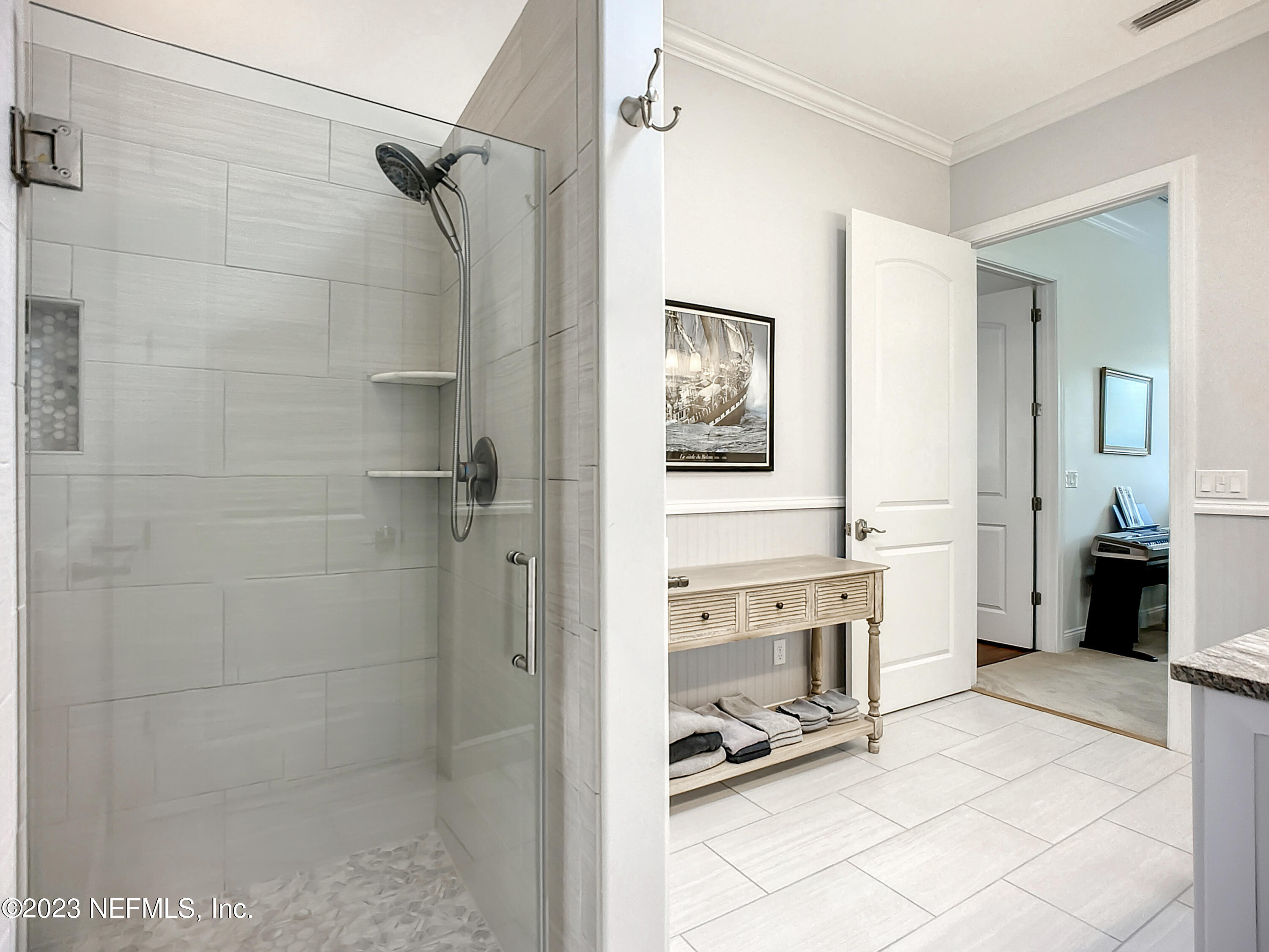 5356 2nd Street St. Augustine, FL 32080 - Photo 28 of 60 a bathroom with a double vanity sink a mirror and a shower