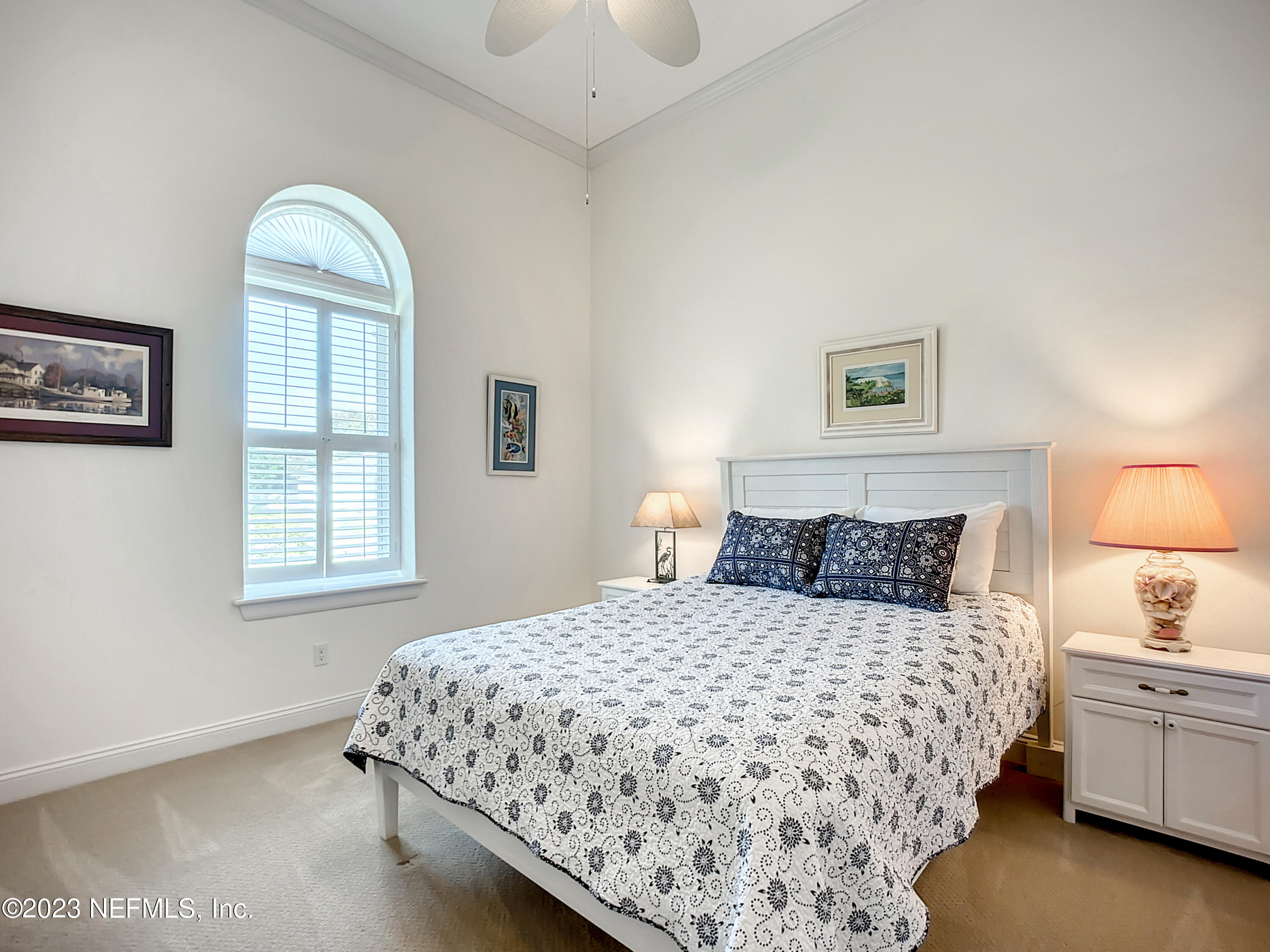 5356 2nd Street St. Augustine, FL 32080 - Photo 35 of 60 a bedroom with a large bed and a window