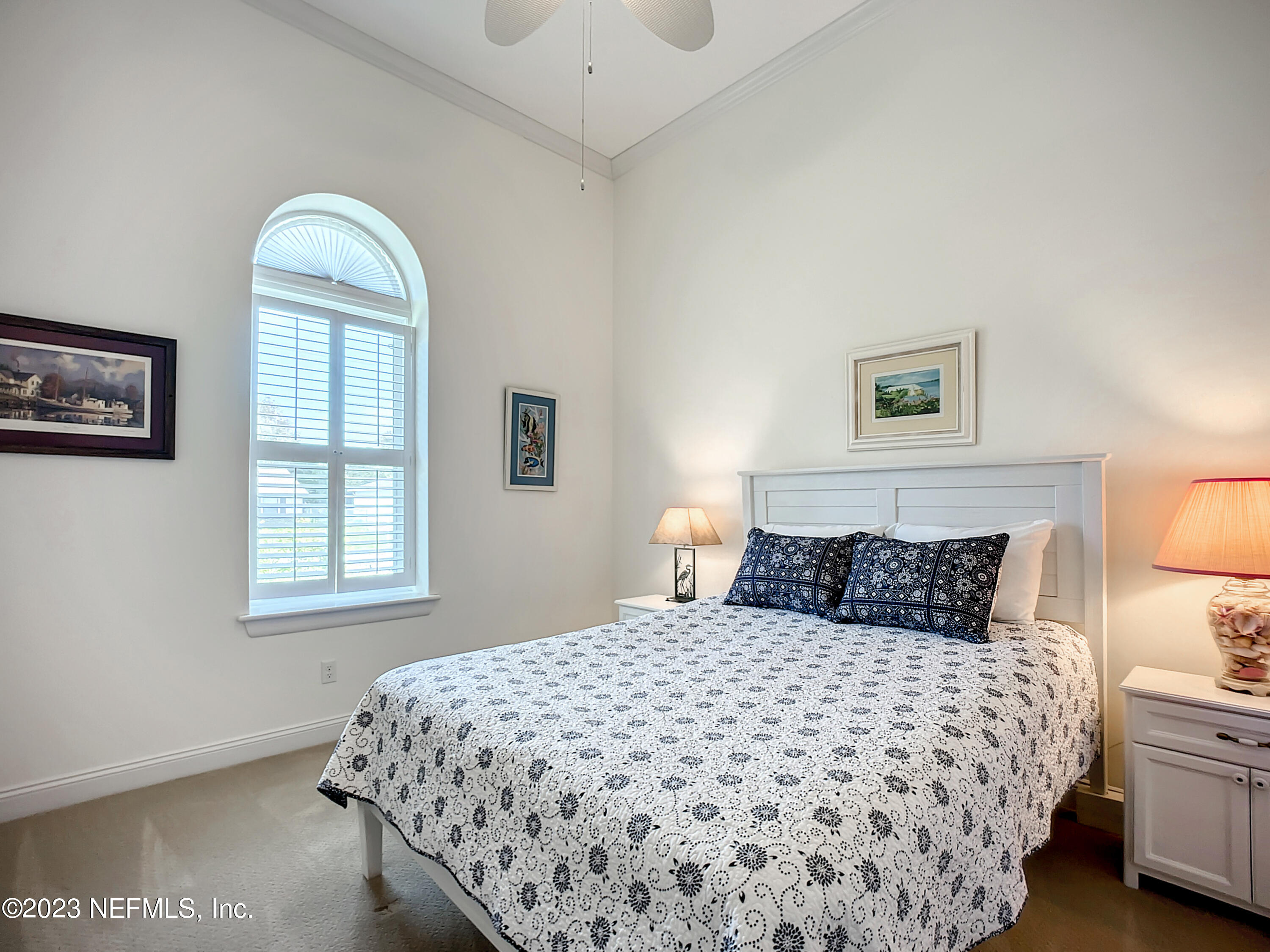 5356 2nd Street St. Augustine, FL 32080 - Photo 36 of 60 a bedroom with a large bed and a window