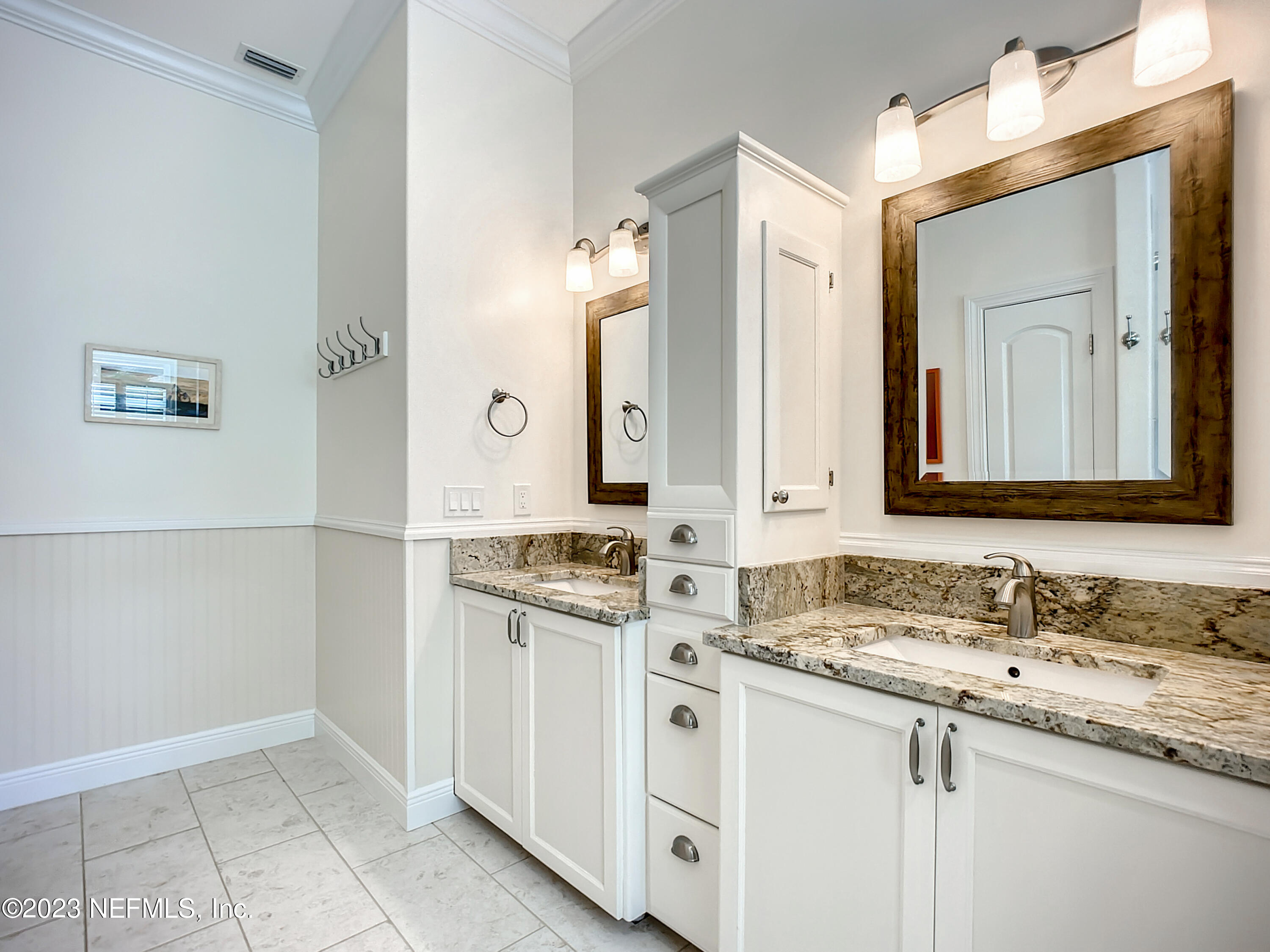 5356 2nd Street St. Augustine, FL 32080 - Photo 39 of 60 a bathroom with a granite countertop sink and a mirror