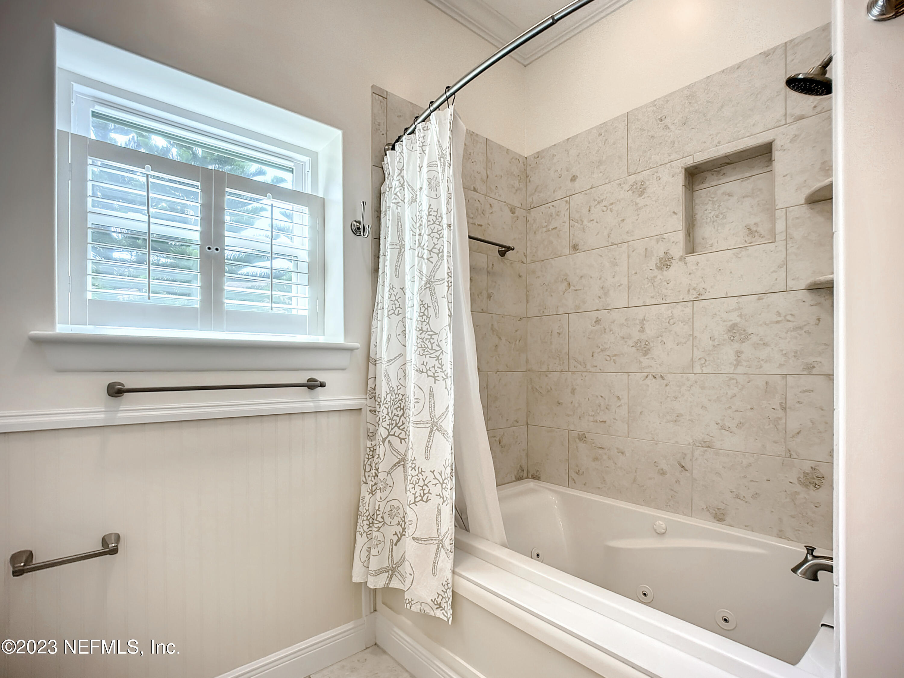 5356 2nd Street St. Augustine, FL 32080 - Photo 42 of 60 a white bath tub sitting next to a window