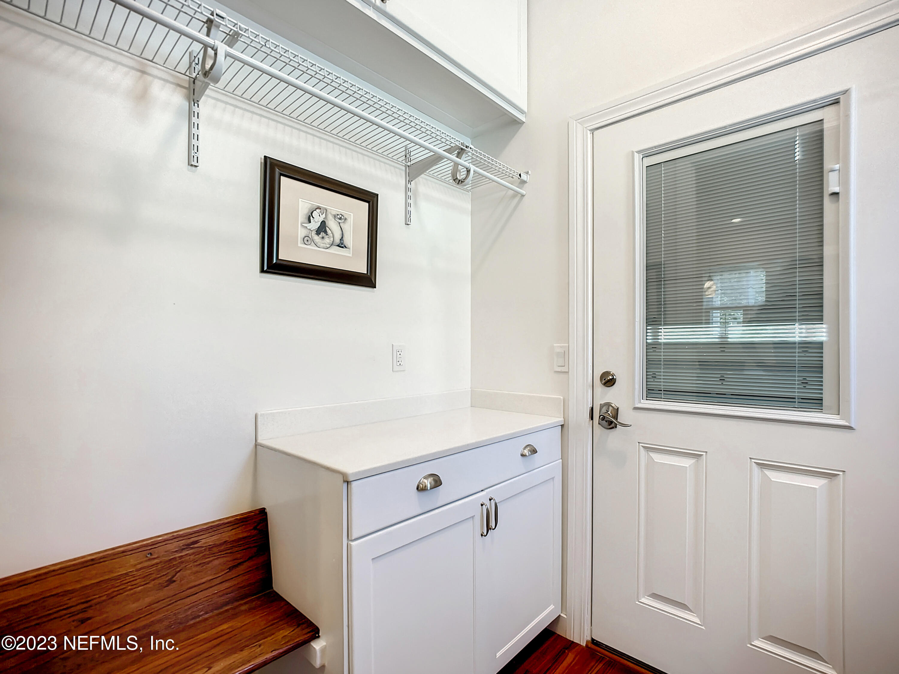 5356 2nd Street St. Augustine, FL 32080 - Photo 45 of 60 a room with a door and a wooden floor