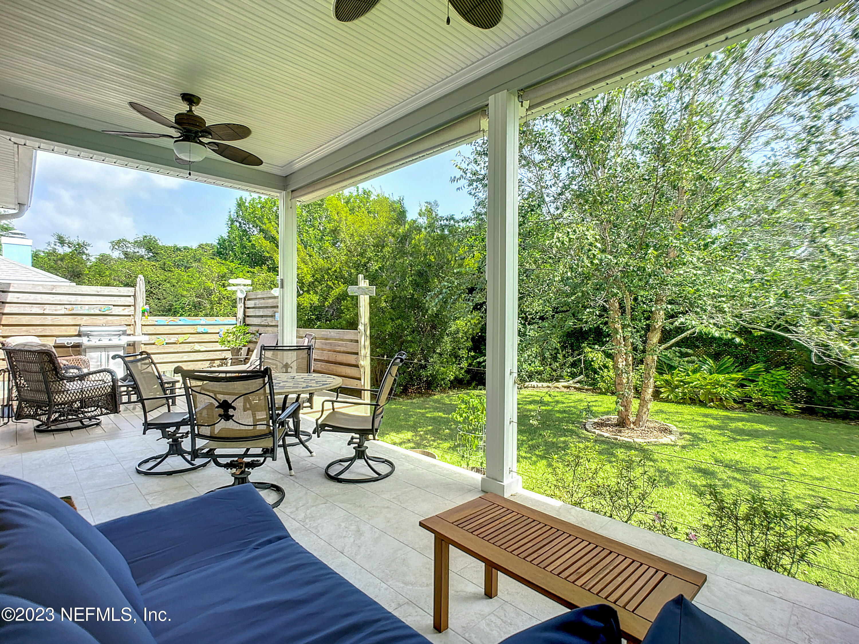 5356 2nd Street St. Augustine, FL 32080 - Photo 49 of 60 a view of a chairs and table in patio with wooden floor